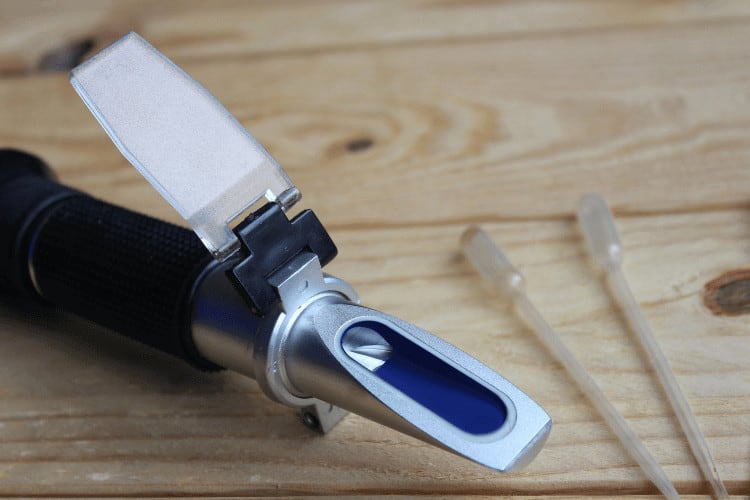 A Refractometer for Home Brewing on a Wooden Table