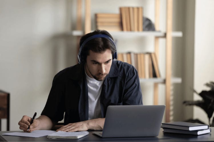 A young man studying on online courses