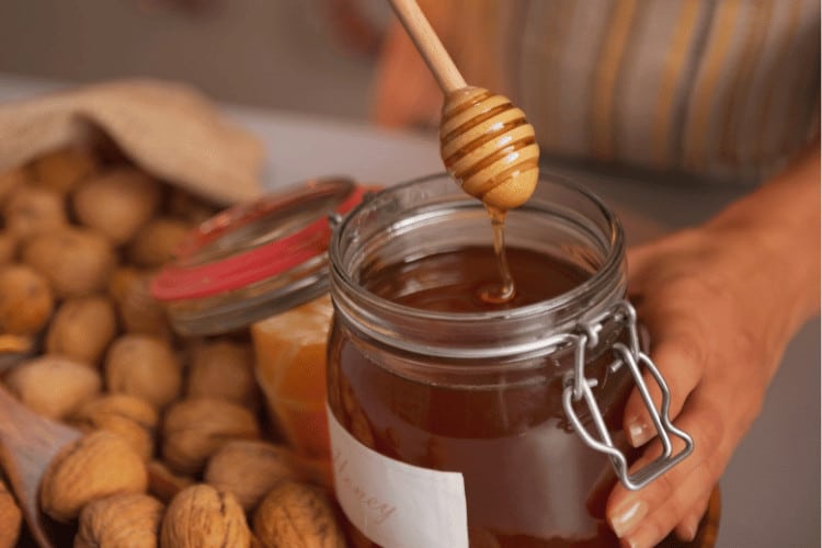 Honey Dipper in a Glass Honey Jar